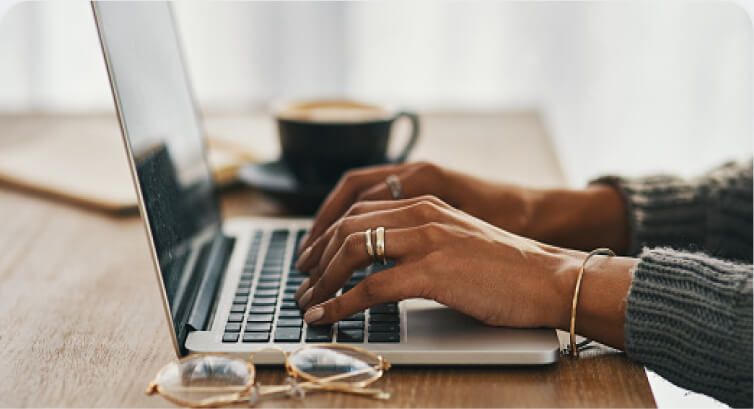 Hands on open laptop