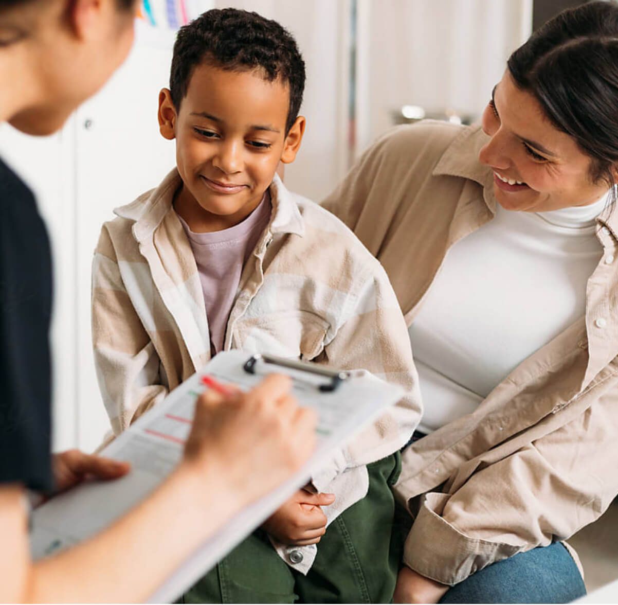 Mother and son with doctor