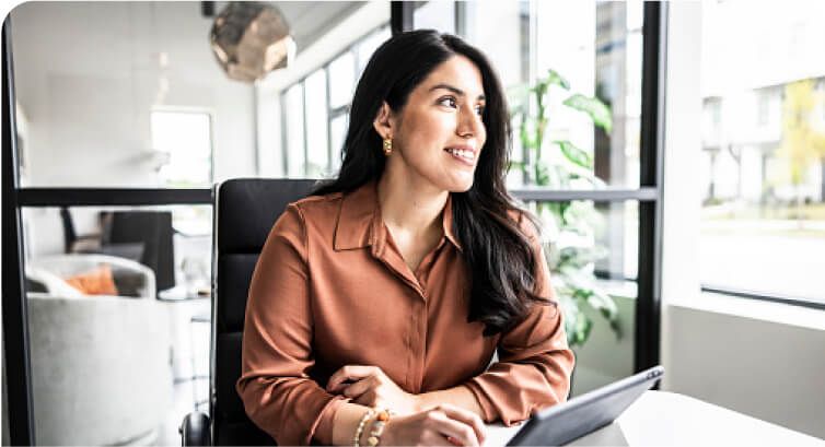 Seated woman looking out window
