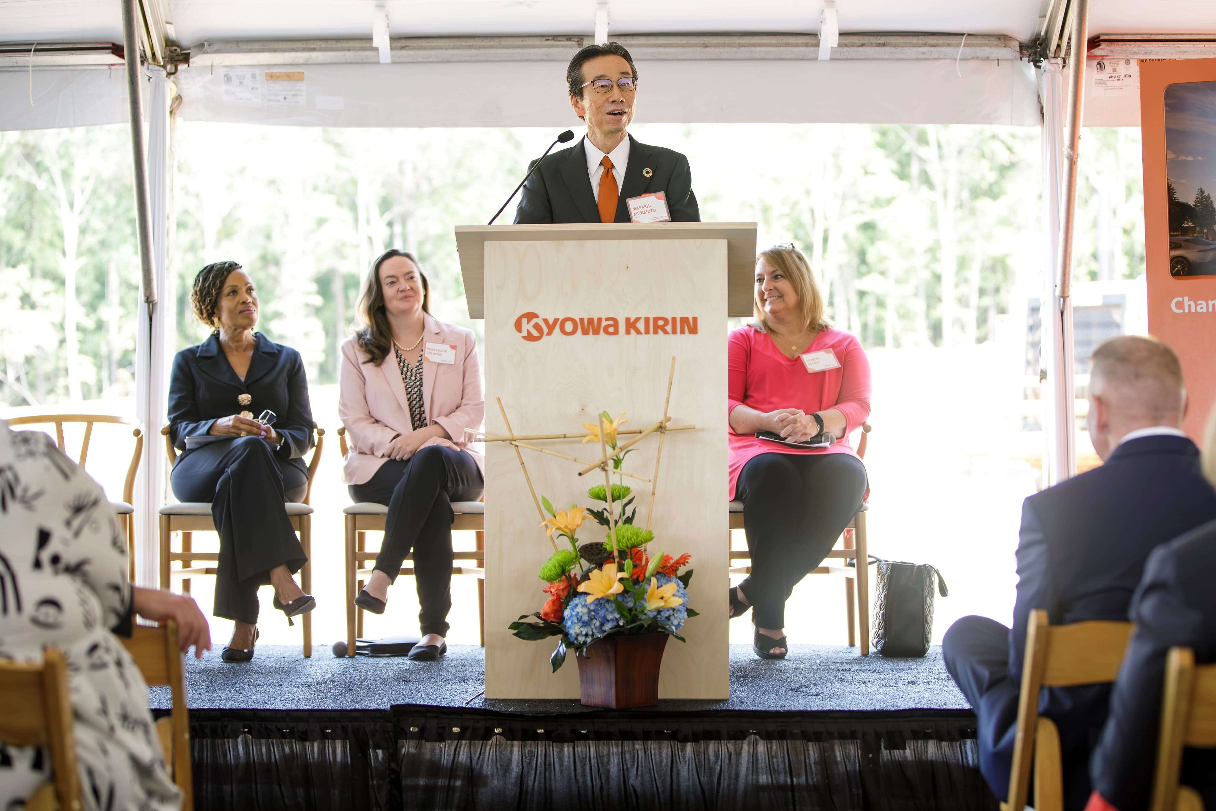 Kyowa Kirin executive speaks at podium