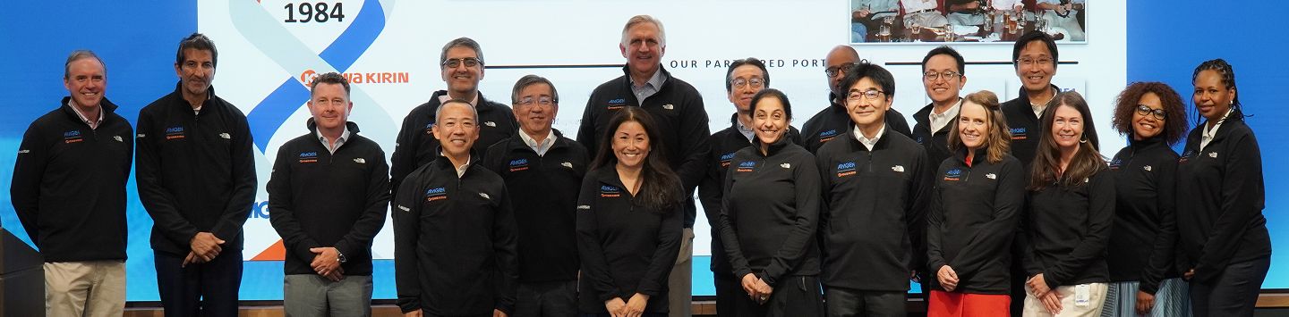 Team of scientists and researchers facing camera