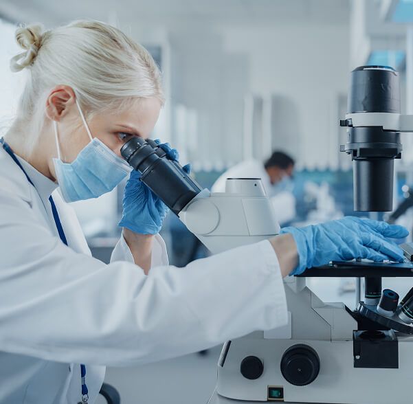 Doctor using microscope