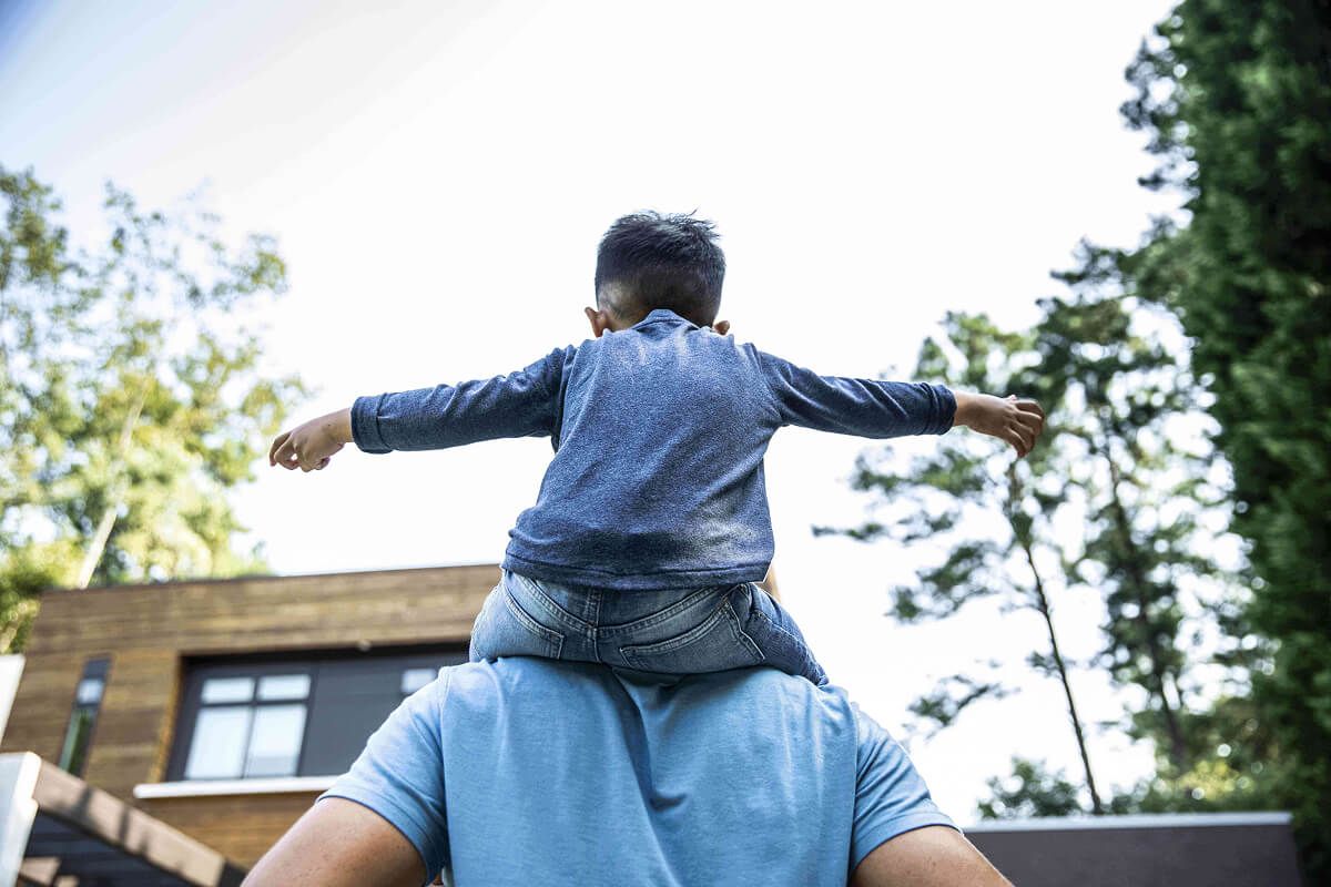 Boy on father’s shoulders