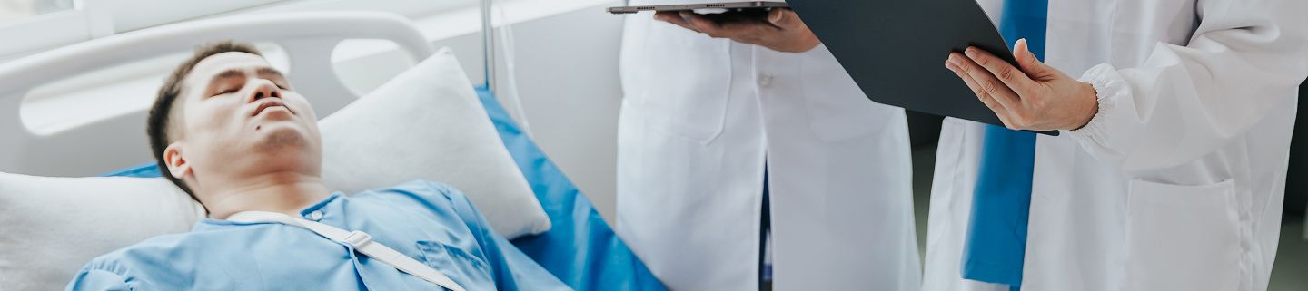 Patient laying, doctors