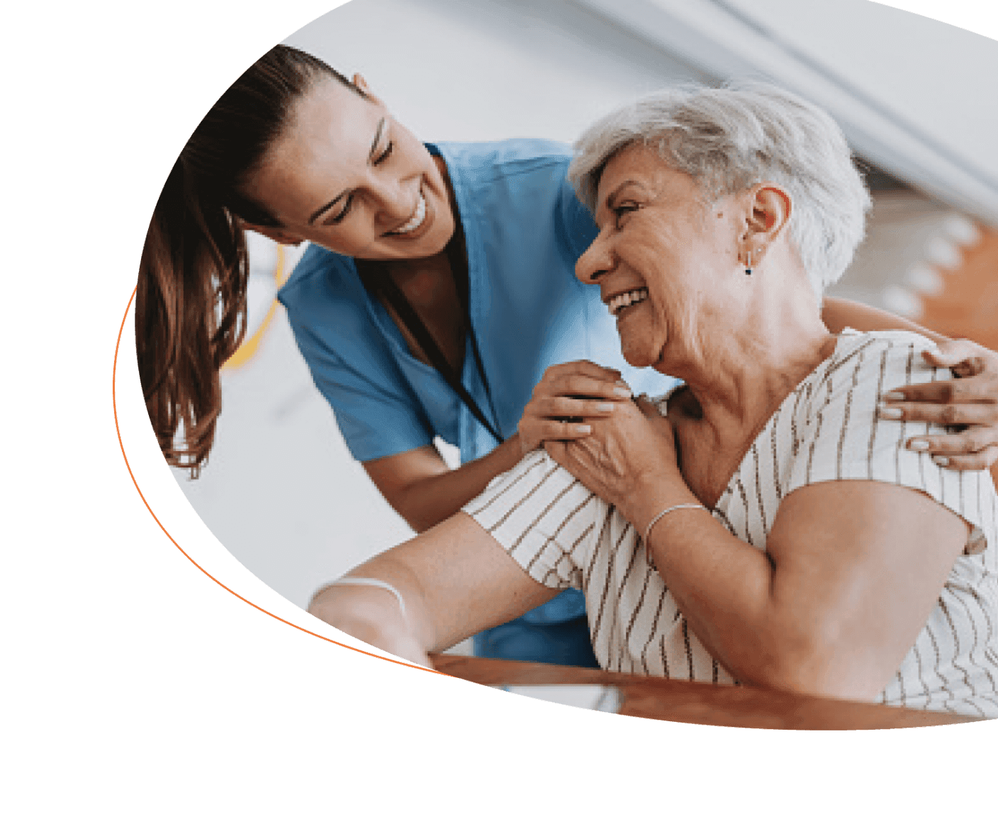 Nurse with older patient, hands on her shoulders
