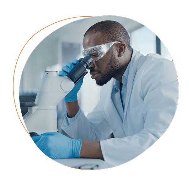 Scientist at microscope