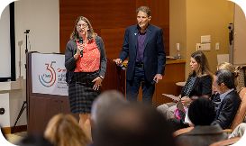 2 people presenting work