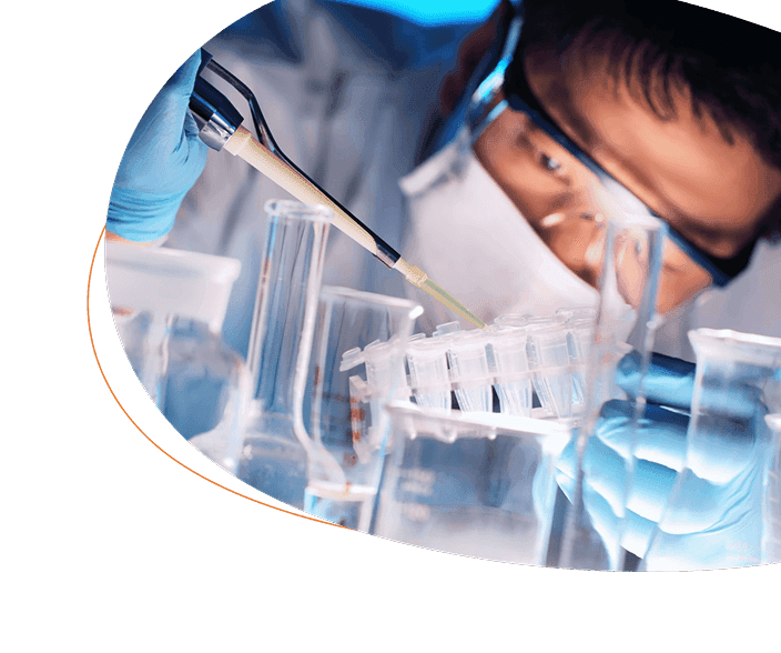 Scientist looking at test tubes