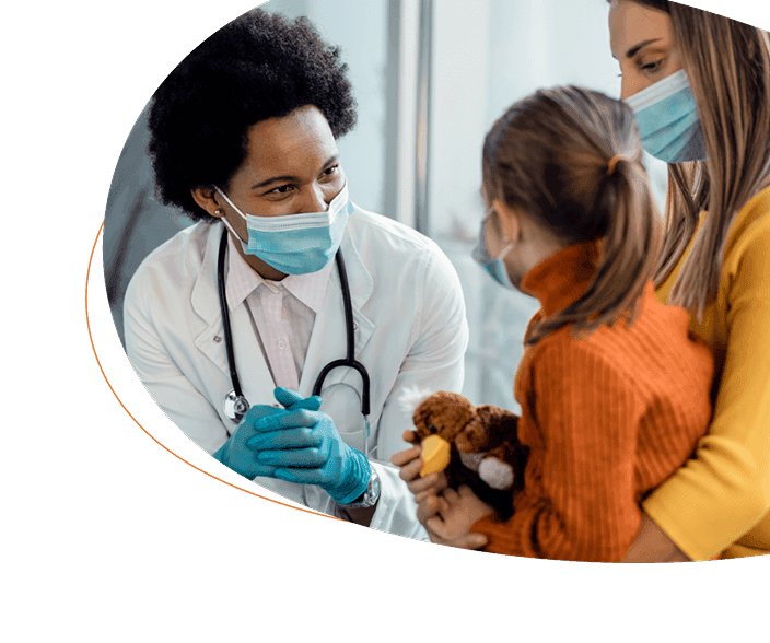 Doctor sitting with mother and daughter