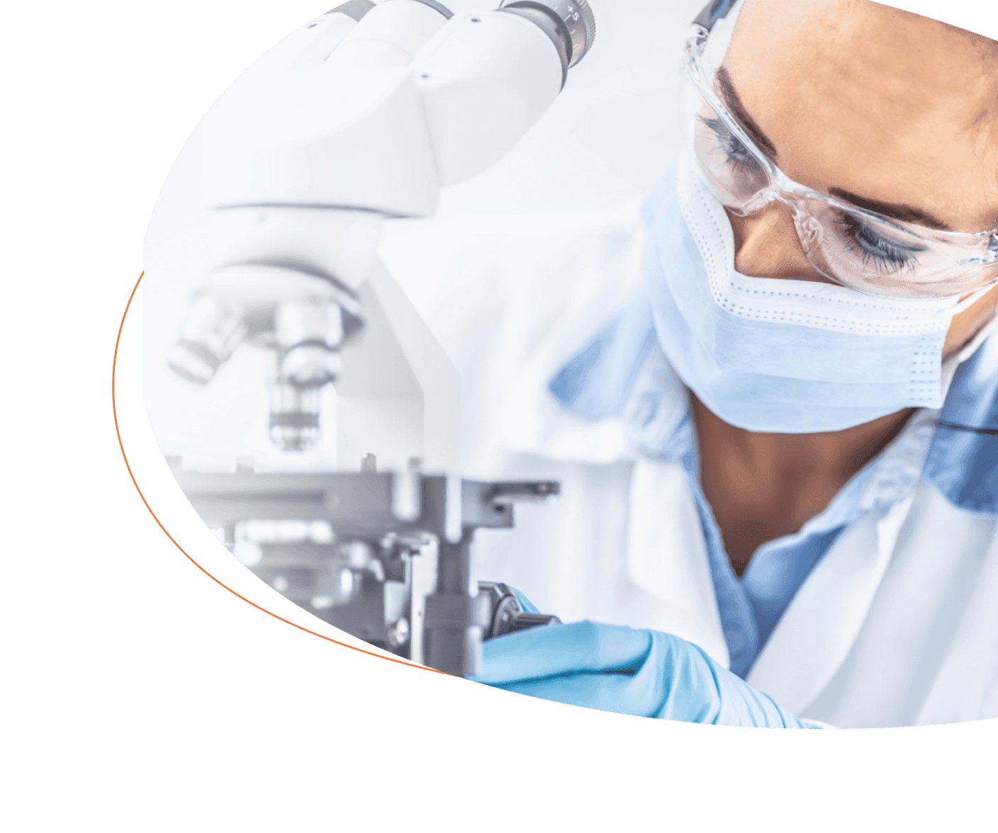 Bench scientist at microscope